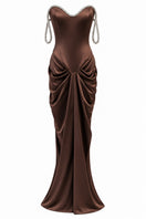 Elegant brown EVANIA gown by URBAN MUSE featuring flowing fabric and sophisticated design, perfect for formal occasions.