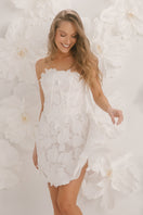 White mini dress from Ellipse Lingerie, showcasing the exterior view with stylish design and lightweight fabric.