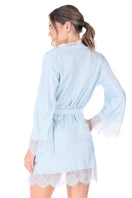 Blue loungewear kimono by Ellipse Lingerie, featuring soft fabric and relaxed fit, displayed on a hanger against a neutral background.
