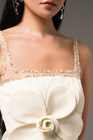 Light yellow CULT MIA X HAPPY CLOTHING Anahi fit and flare mini dress hanging on a wooden hanger.