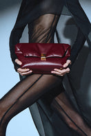 Rose de Mai FAYE clutch in burgundy, stylish leather clutch bag with elegant design and gold-tone accents.