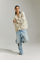 First Born Knits Brigitte Bomber Cardigan in off-white, XS-S, featuring a cozy, stylish knit design.