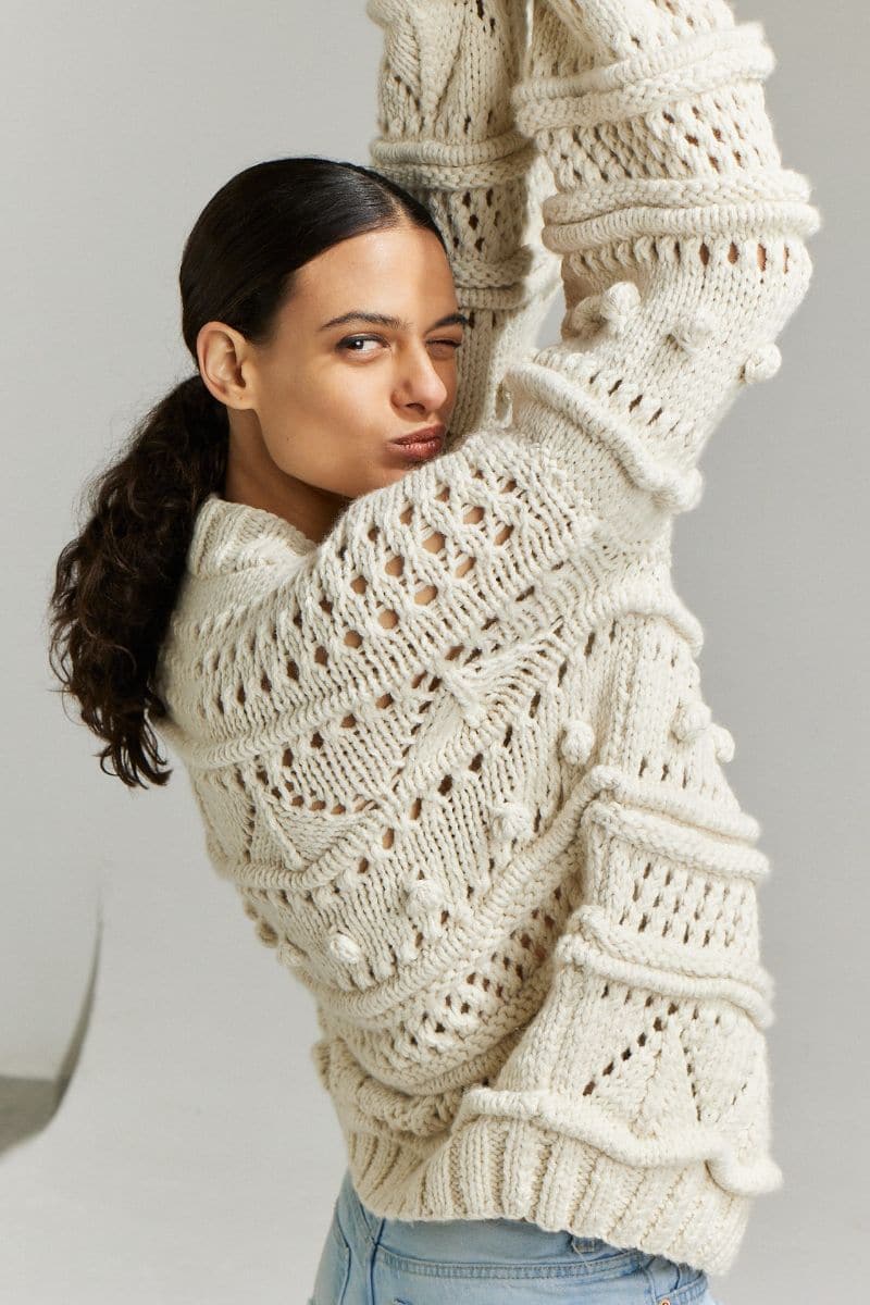 Off-white Brigitte Bomber Cardigan by First Born Knits, shown in XS-S size with a cozy, relaxed fit and stylish knit pattern.