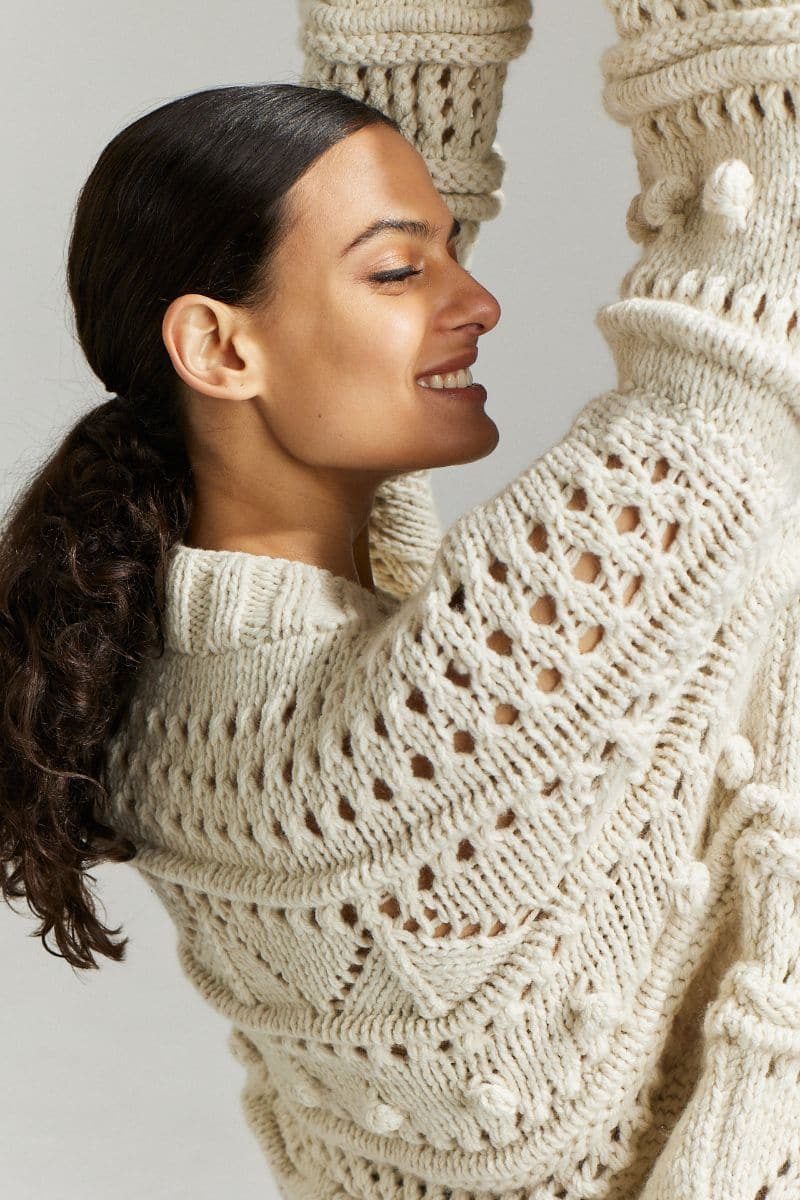 Off-white Brigitte Bomber Cardigan by First Born Knits, shown in size XS/S with a cozy, stylish fit.