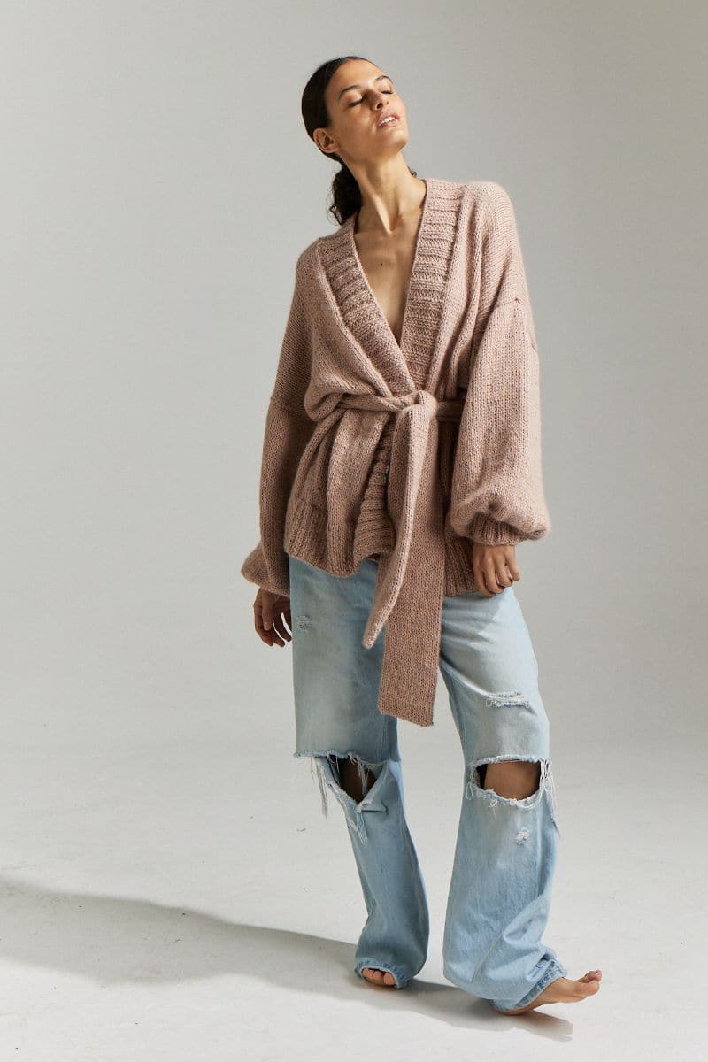 First Born Knits Demoiselle oversized belted cardigan in blush, featuring a relaxed fit and waist belt, shown in size XS/S.