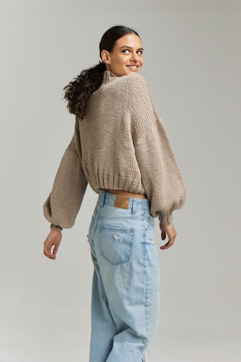 First Born Knits Evie cropped turtleneck sweater in taupe, showing close-up of knit texture and fitted style.