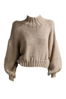 First Born Knits Evie cropped turtleneck sweater in taupe, showcasing a fitted design with ribbed knit texture.