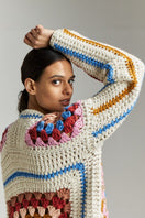 Multicolor First Born Knits Farrah hand-crochet cardigan in XS-S, detailed close-up of the textured, multicolored knit fabric.