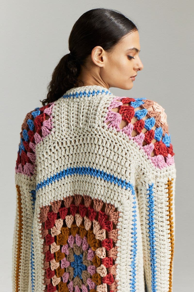 Multicolor First Born Knits Farrah hand-crochet cardigan in XS/S, featuring intricate crochet pattern and cozy fit.