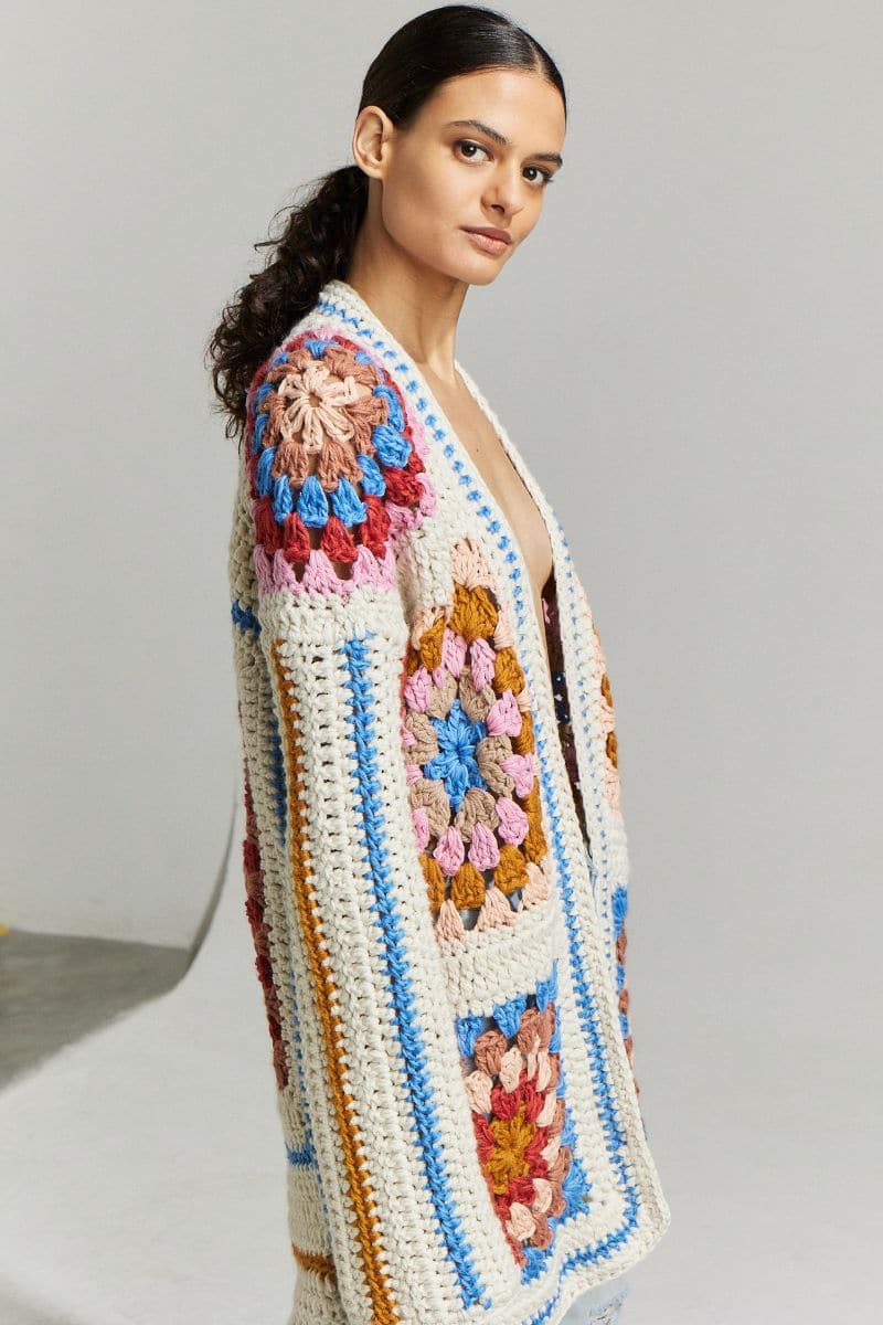 Multicolor First Born Knits Farrah hand-crochet cardigan in XS-S, featuring intricate crochet patterns and cozy knit fabric.