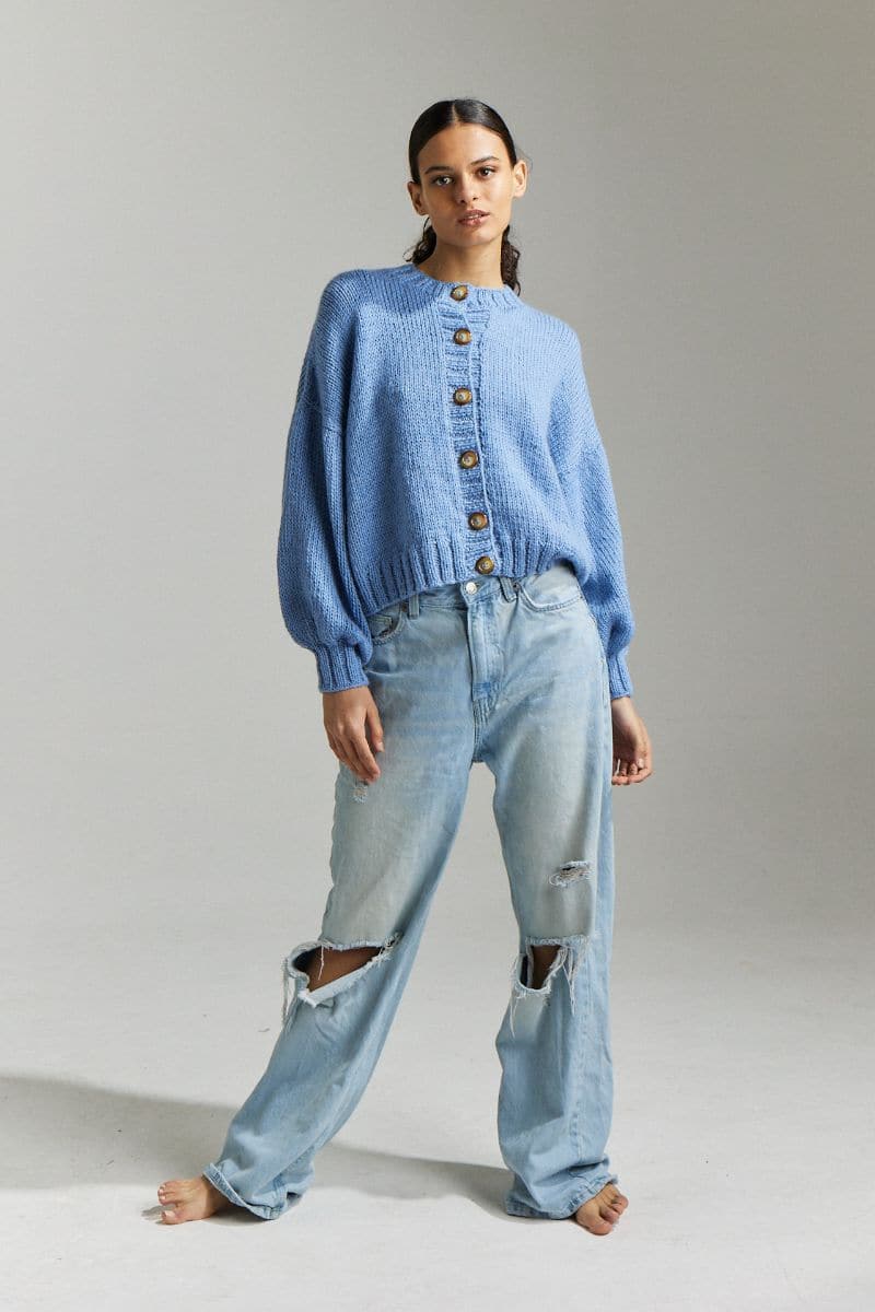 Sky blue Frenchie Midi Cardigan by First Born Knits, featuring a cozy knit fabric and a stylish, relaxed fit.