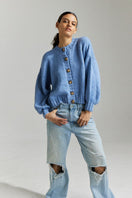Sky blue Frenchie Midi Cardigan by First Born Knits, showing a cozy knitted cardigan with a relaxed fit and button details.