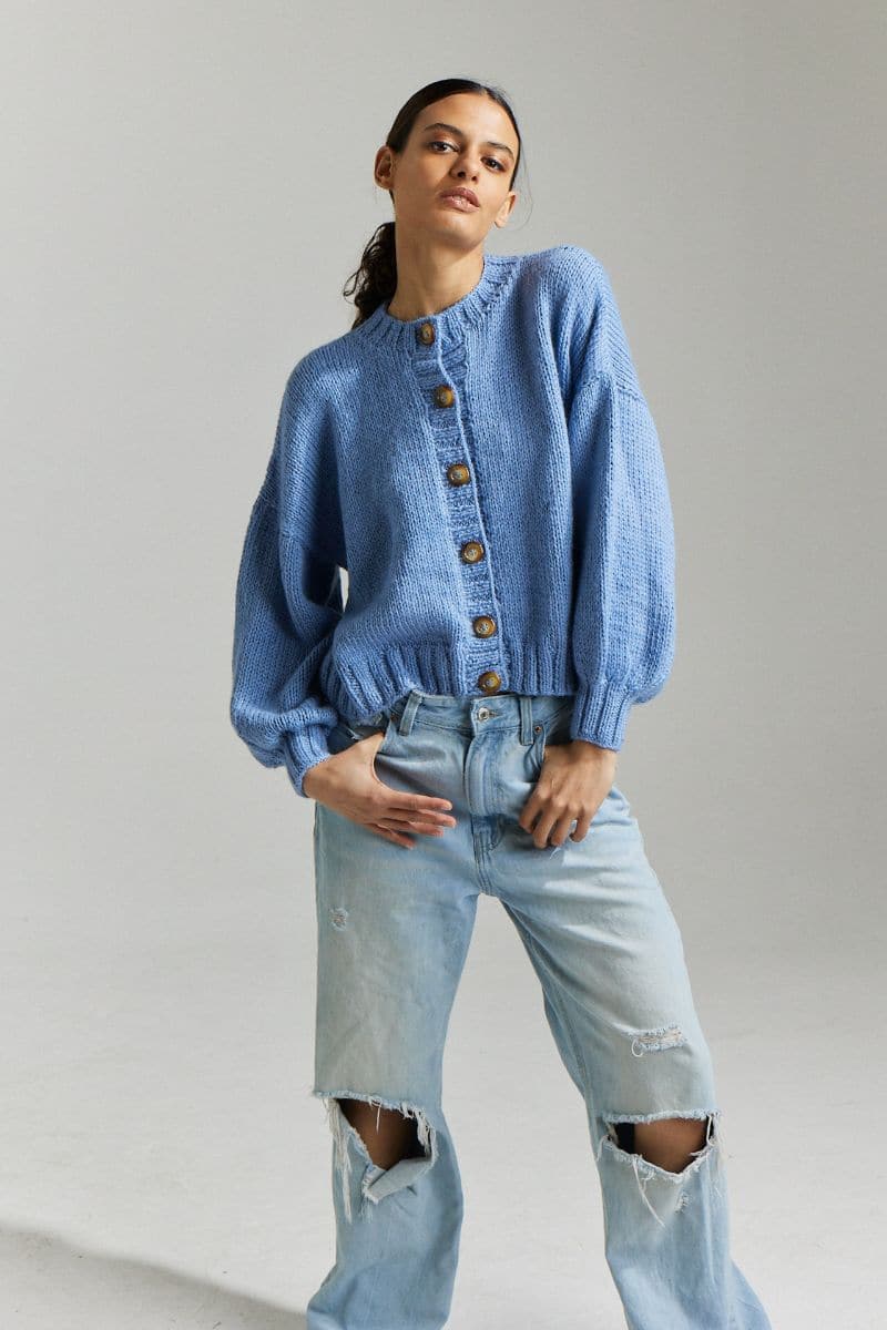 Sky blue Frenchie Midi Cardigan by First Born Knits, showing a cozy knitted cardigan with a relaxed fit and button details.