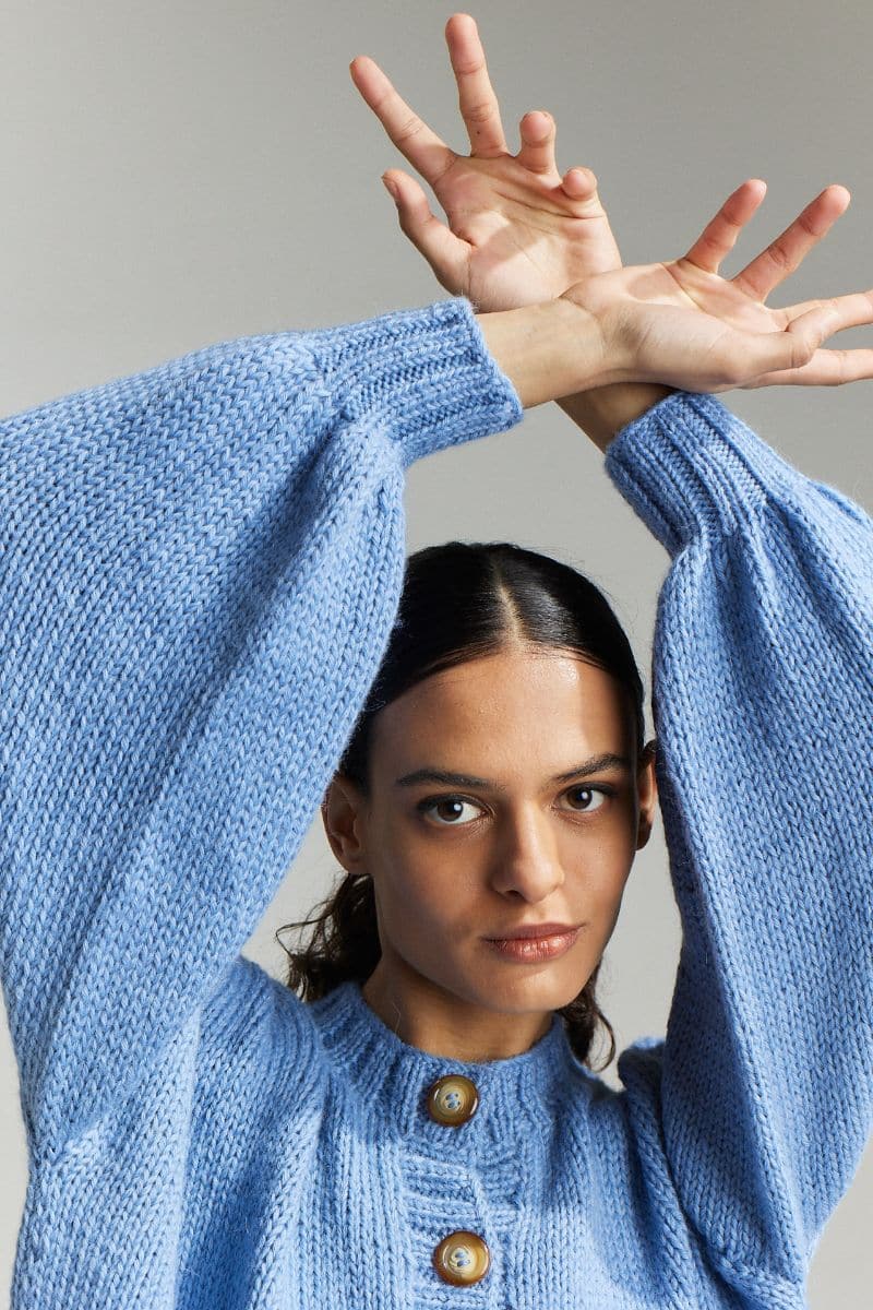 Sky blue Frenchie Midi Cardigan by First Born Knits, featuring a cozy knit design and button front in XS-S size.