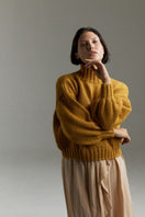 Mustard Eve midi turtleneck sweater by First Born Knits, featuring a cozy knit design and fitted silhouette in XS-S.