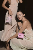 Pink fringe mini Kyklos bag from Folklore The Label, stylish top handle bag with vibrant fringe detailing.