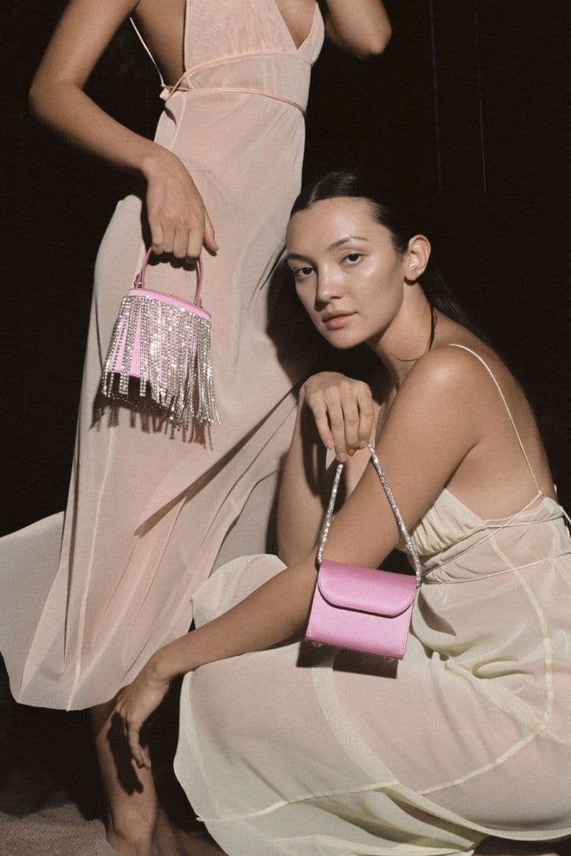 Pink fringe mini Kyklos bag from Folklore The Label, stylish top handle bag with vibrant fringe detailing.
