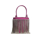 Pink fringe mini Kyklos bag from Folklore The Label, a stylish top handle bag with vibrant fringe detailing.