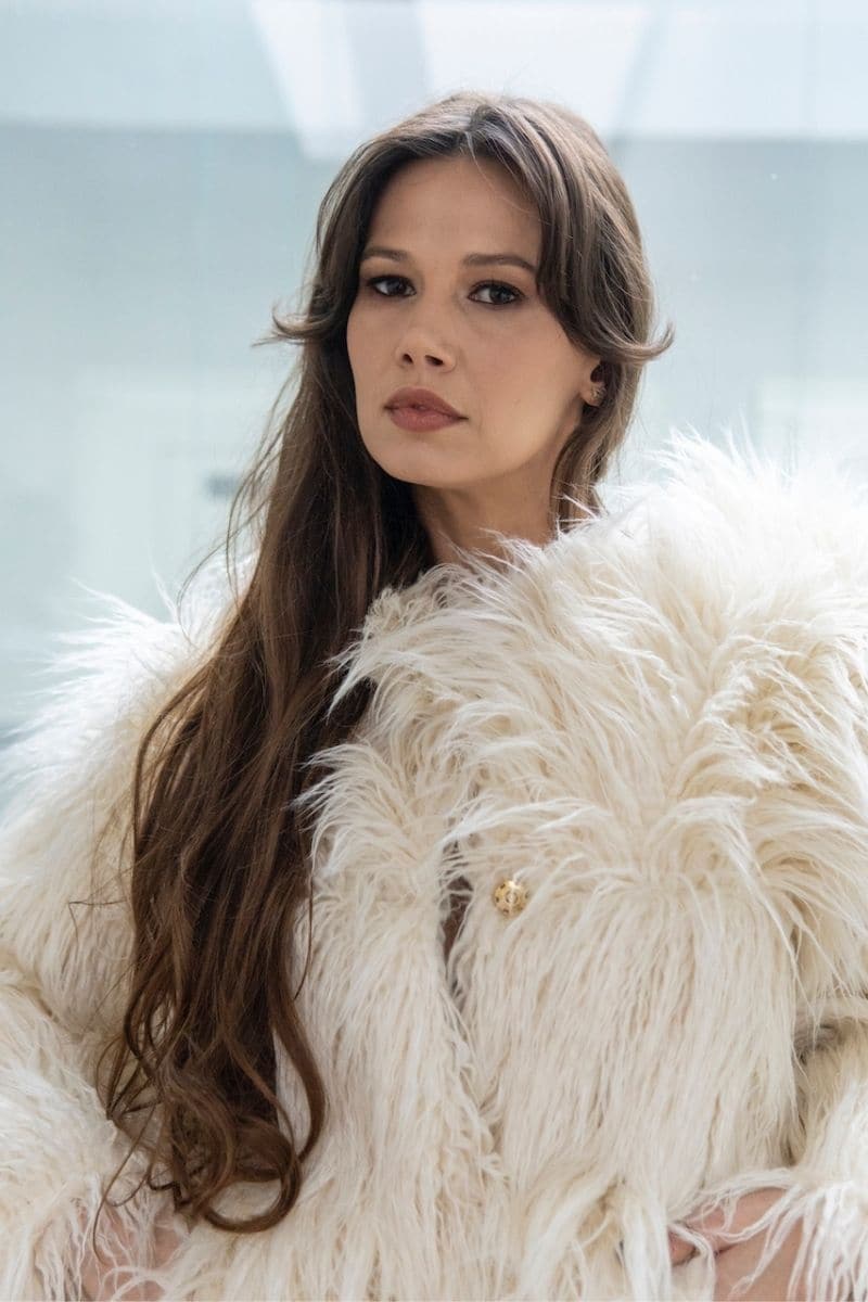 Cream faux fur jacket by Fortini, stylish and warm, shown on a model with a plush collar and cozy fit.