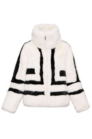 White sporty faux fur jacket by Fortini, featuring a stylish design with black accents, shown on a model in size XS.