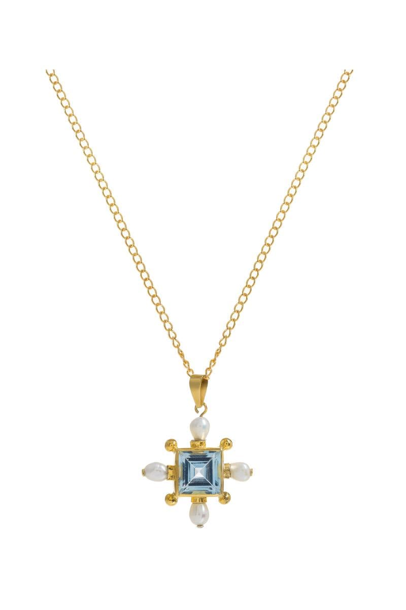 Gold Blue Topaz Cross Necklace by Freya Rose featuring a vibrant blue topaz pendant on a delicate chain