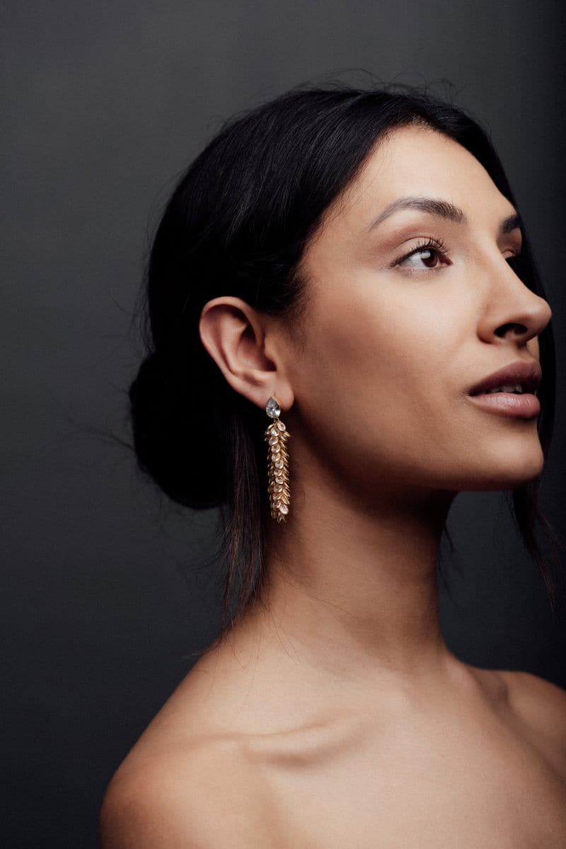 Gold crystal drop earrings by Freya Rose featuring elegant, sparkling crystal drops hanging from gold-toned earring hooks.