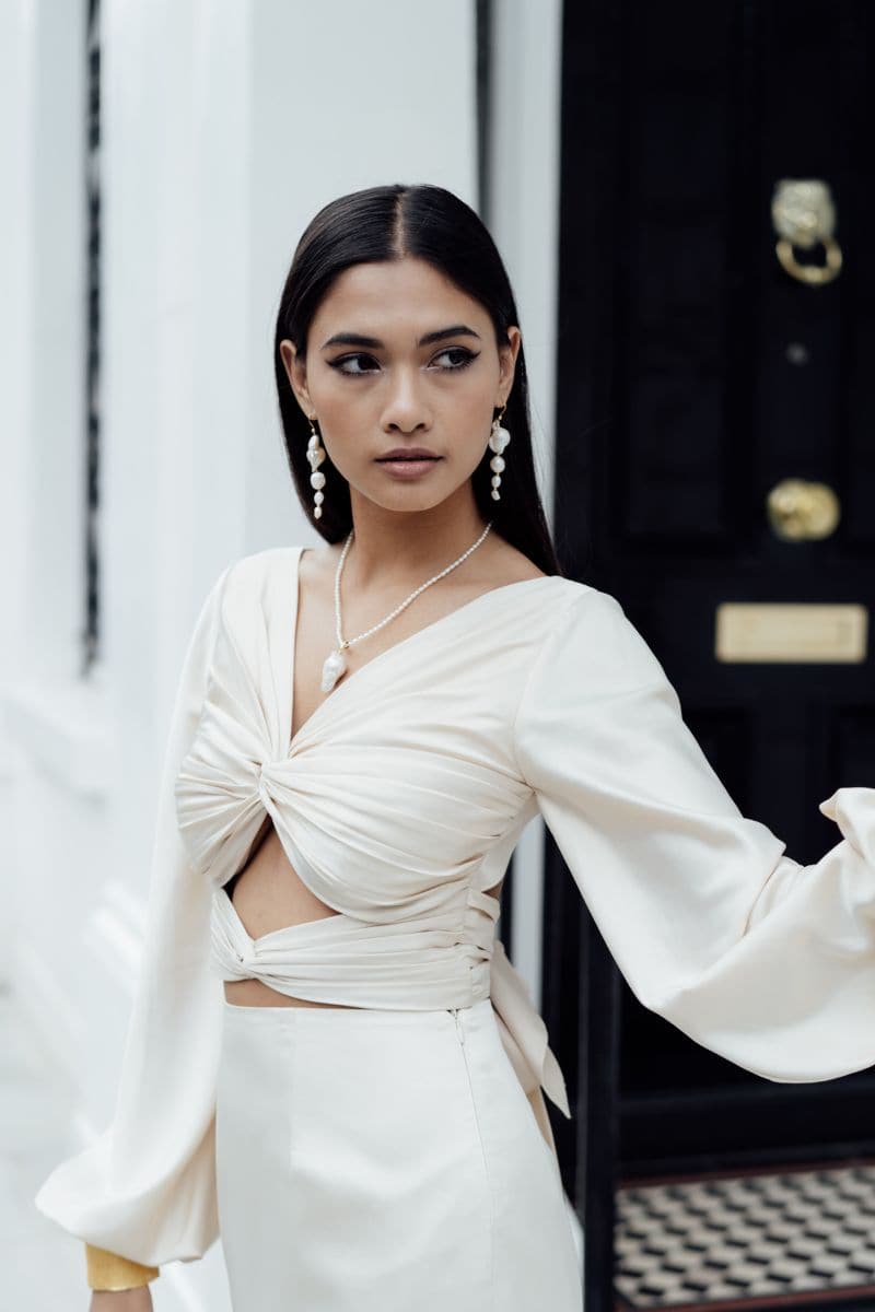 Large baroque drop pearl earrings by Freya Rose featuring gold setting and elegant, irregular pearl drops.