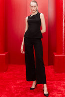 Joanna Andraos midnight black co-ords set with top, pants, and detachable emerald cape, front view showing stylish ensemble.