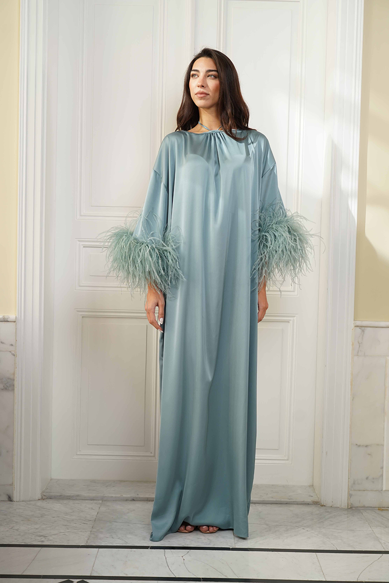 Joanna Andraos silk gown with tie-neck and feather sleeves, elegant front view showcasing luxurious fabric and stylish design.