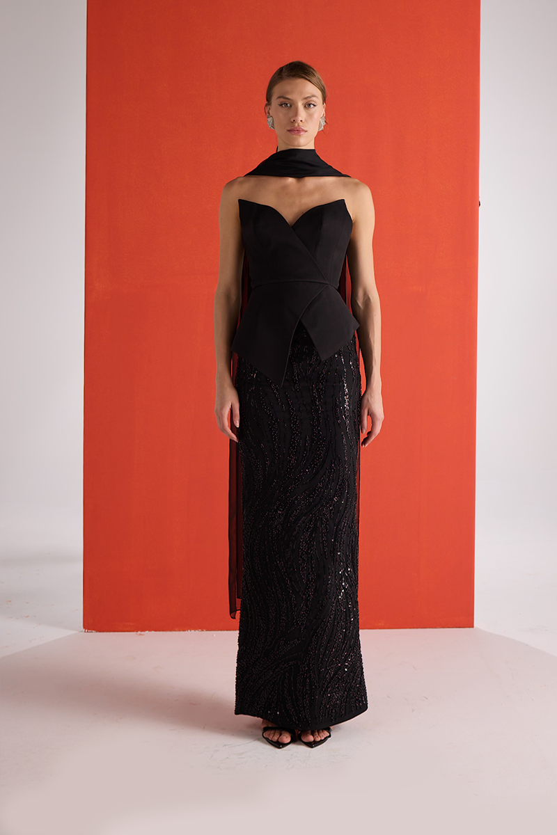 Black embroidered corset co-ords set by Joanna Andraos, featuring front view with detailed embroidery and fitted design.