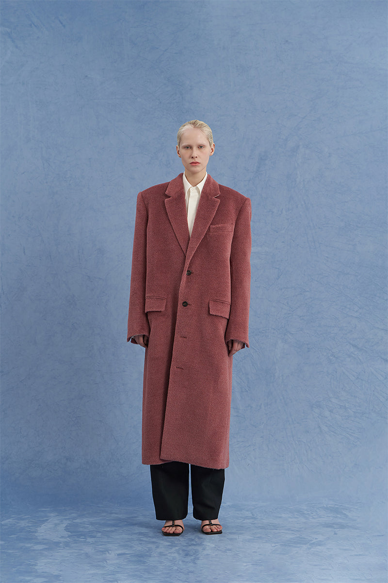 Pink oversized Suri alpaca coat by JINSUN, front view showcasing plush, textured fabric and relaxed fit.