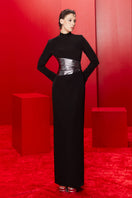 Joanna Andraos midnight black halterneck gown with metallic draped waist, front view showcasing elegant design and fitted silhouette.