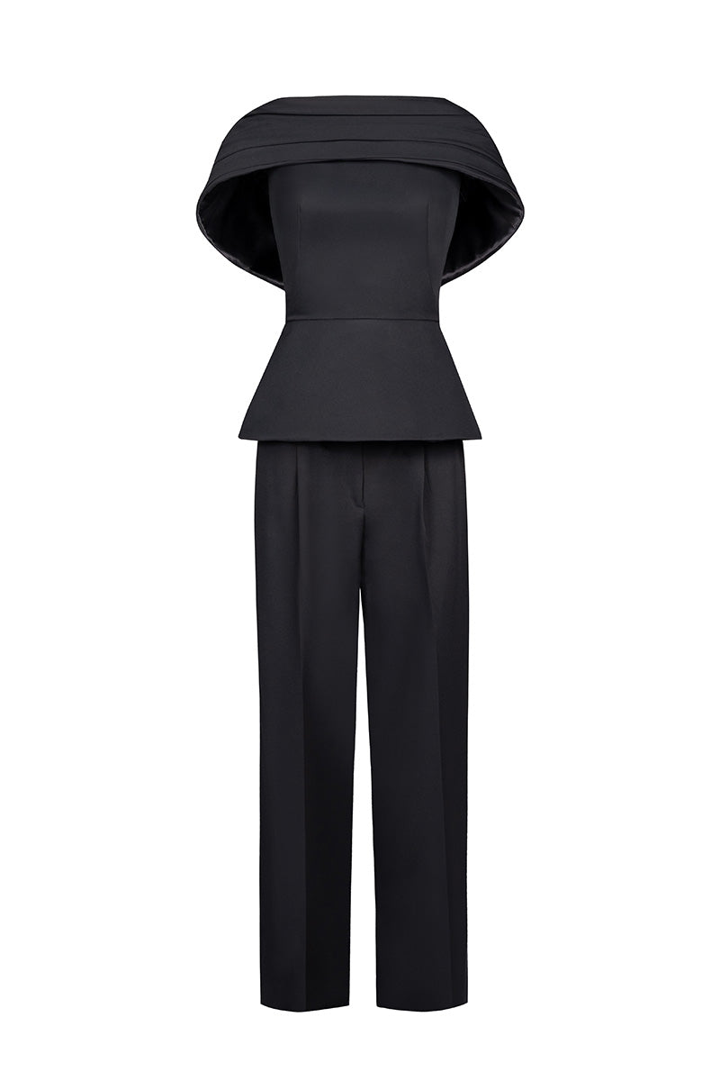 Joanna Andraos black crepe two-piece co-ord set with draped cape, front view showing stylish modern design and elegant fit.