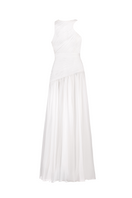 White asymmetrical low waistline gown by Joanna Andraos, front view showing elegant design and flowing fabric.