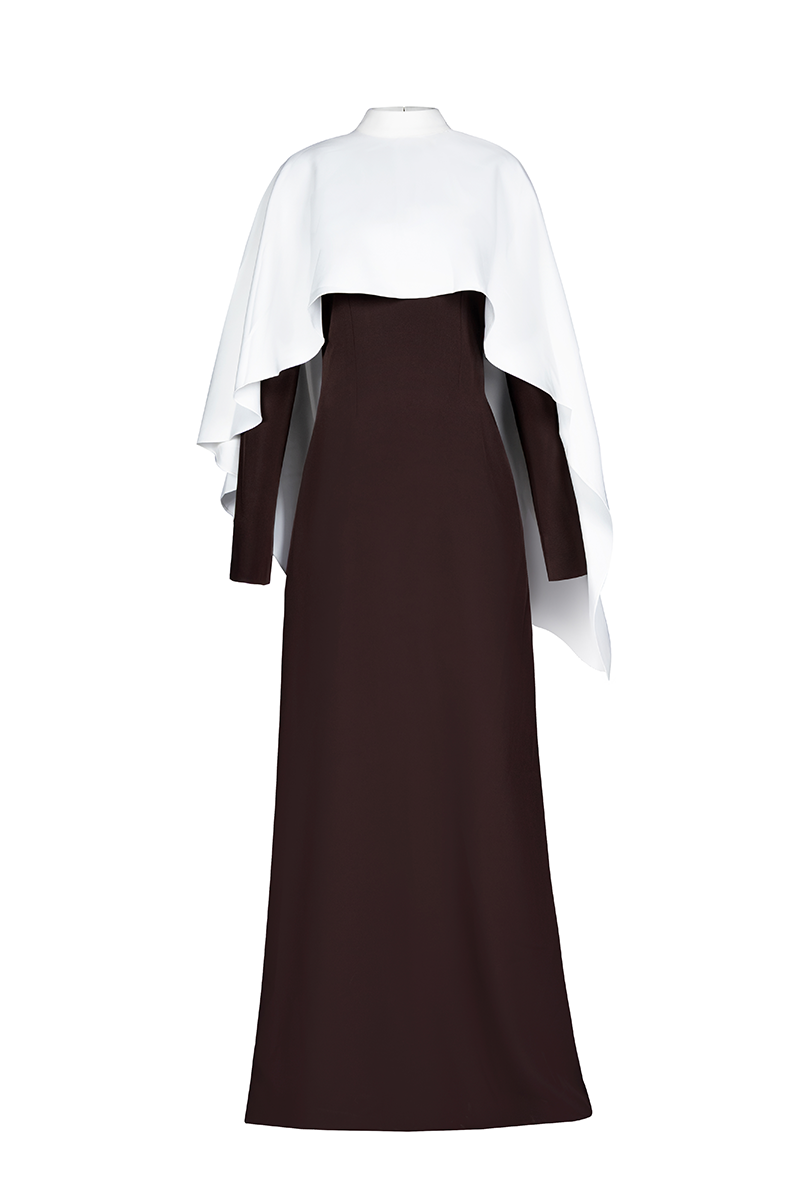 Joanna Andraos ivory cape evening gown with intricate detailing, flowing fabric, and elegant design for formal occasions.