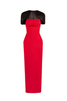 Red strapless tube gown with cape by Joanna Andraos, featuring a fitted bodice and flowing cape detail at the front.