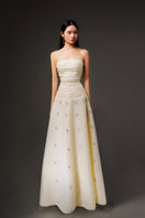 Light yellow terry strapless gown by HAPPY CLOTHING, CULT MIA X HAPPY CLOTHING, featuring stone organza fabric and elegant design.