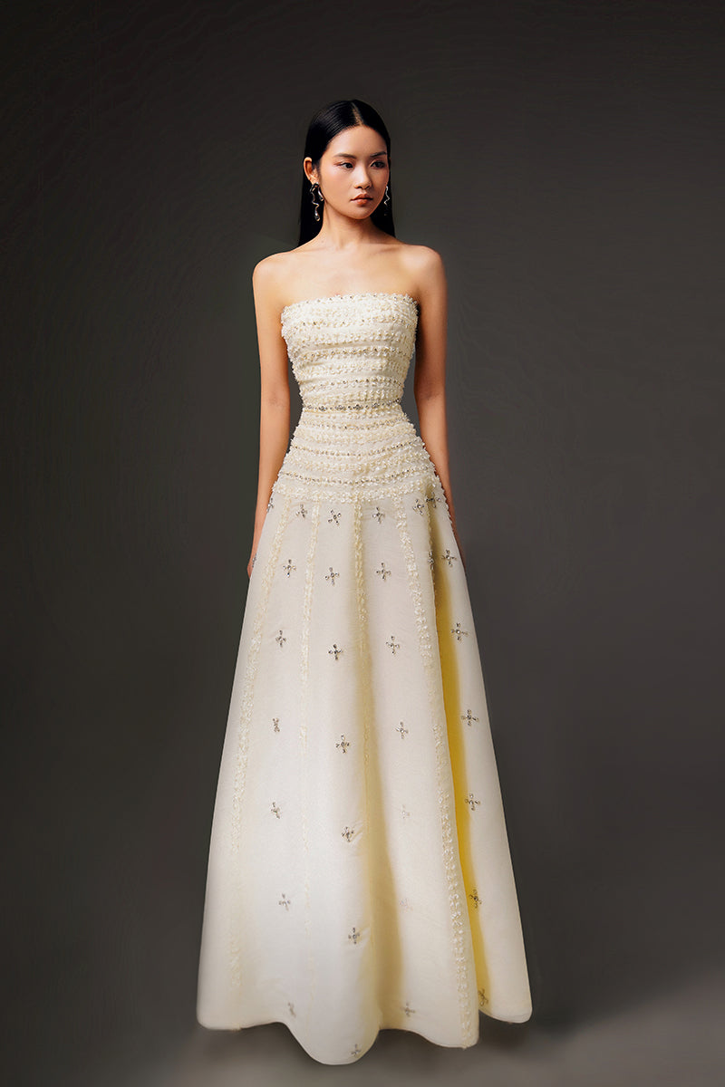 Light yellow terry strapless gown by HAPPY CLOTHING, CULT MIA X HAPPY CLOTHING, featuring stone organza fabric and elegant design.