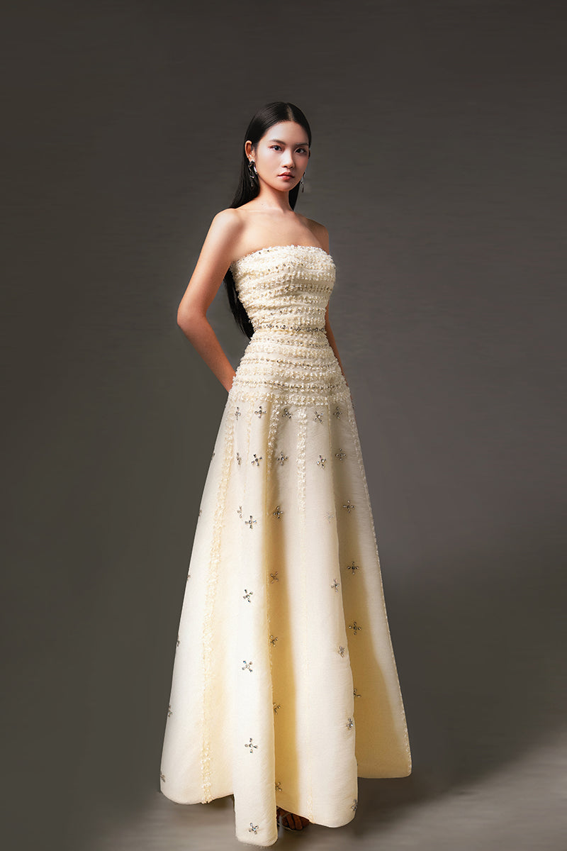 Light yellow terry strapless gown by HAPPY CLOTHING, CULT MIA X collection, made from stone organza fabric, elegant and stylish.