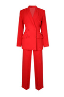 Red hourglass co-ord suit set by Joanna Andraos, featuring a stylish matching top and pants ensemble.