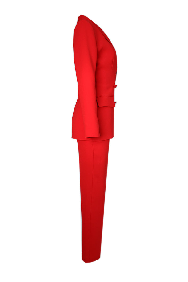 Red hourglass co-ord suit set by Joanna Andraos, featuring a fitted blazer and matching tailored pants.