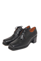 Je La Connais DROP Derby ballerina toe detail black heels, close-up of elegant black slip-on shoes with subtle toe design.