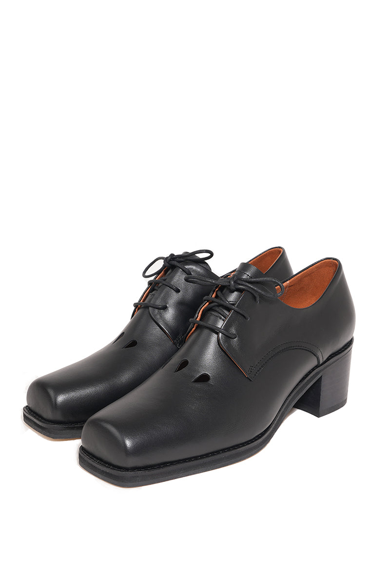 Je La Connais DROP Derby ballerina toe detail black heels, close-up of elegant black slip-on shoes with subtle toe design.