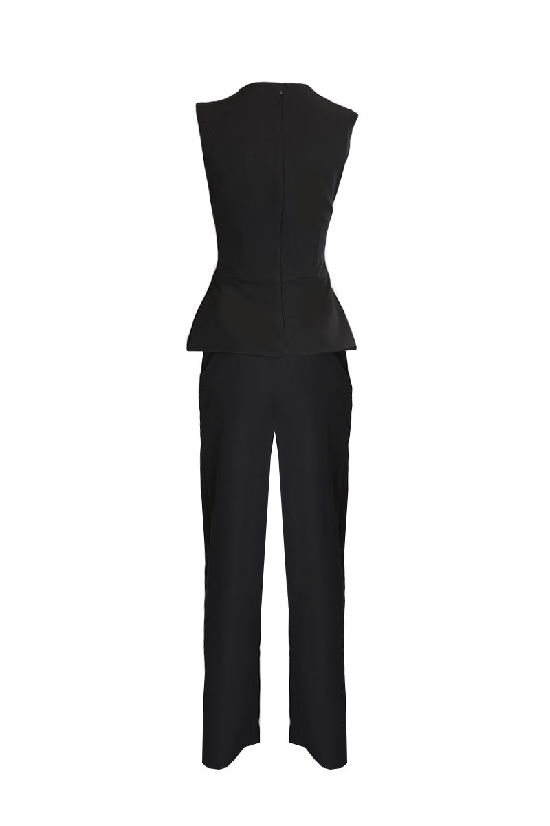 Joanna Andraos midnight black co-ords set with top and pants, featuring a detachable emerald cape and ghost imagery design.