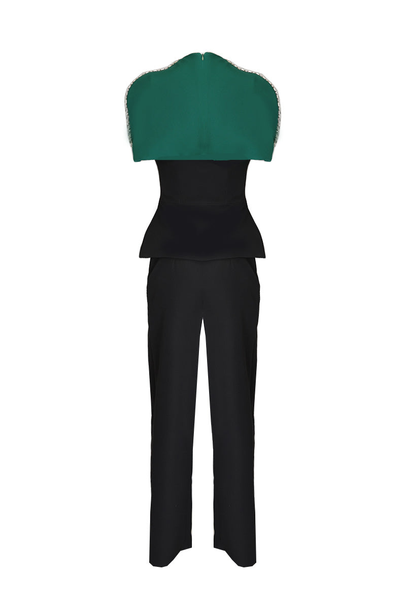 Joanna Andraos black co-ord set with top and pants, featuring a detachable emerald cape, styled for a chic look.