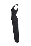 Joanna Andraos midnight black co-ords set with top and pants, featuring a detachable emerald cape and ghost imagery on the side.