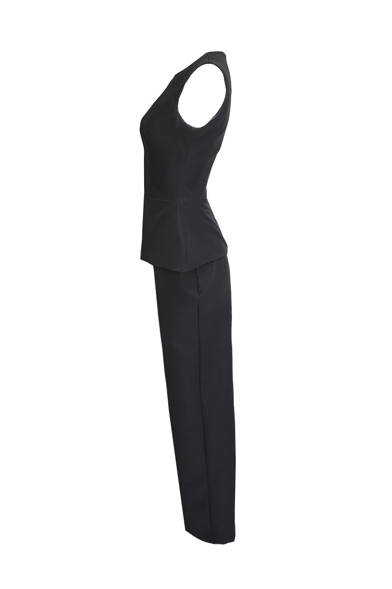 Joanna Andraos midnight black co-ords set with top and pants, featuring a detachable emerald cape and ghost imagery on the side.
