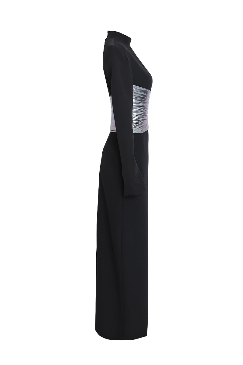 Joanna Andraos midnight black halterneck gown with metallic draped waist, side view showing elegant silhouette and stylish design.