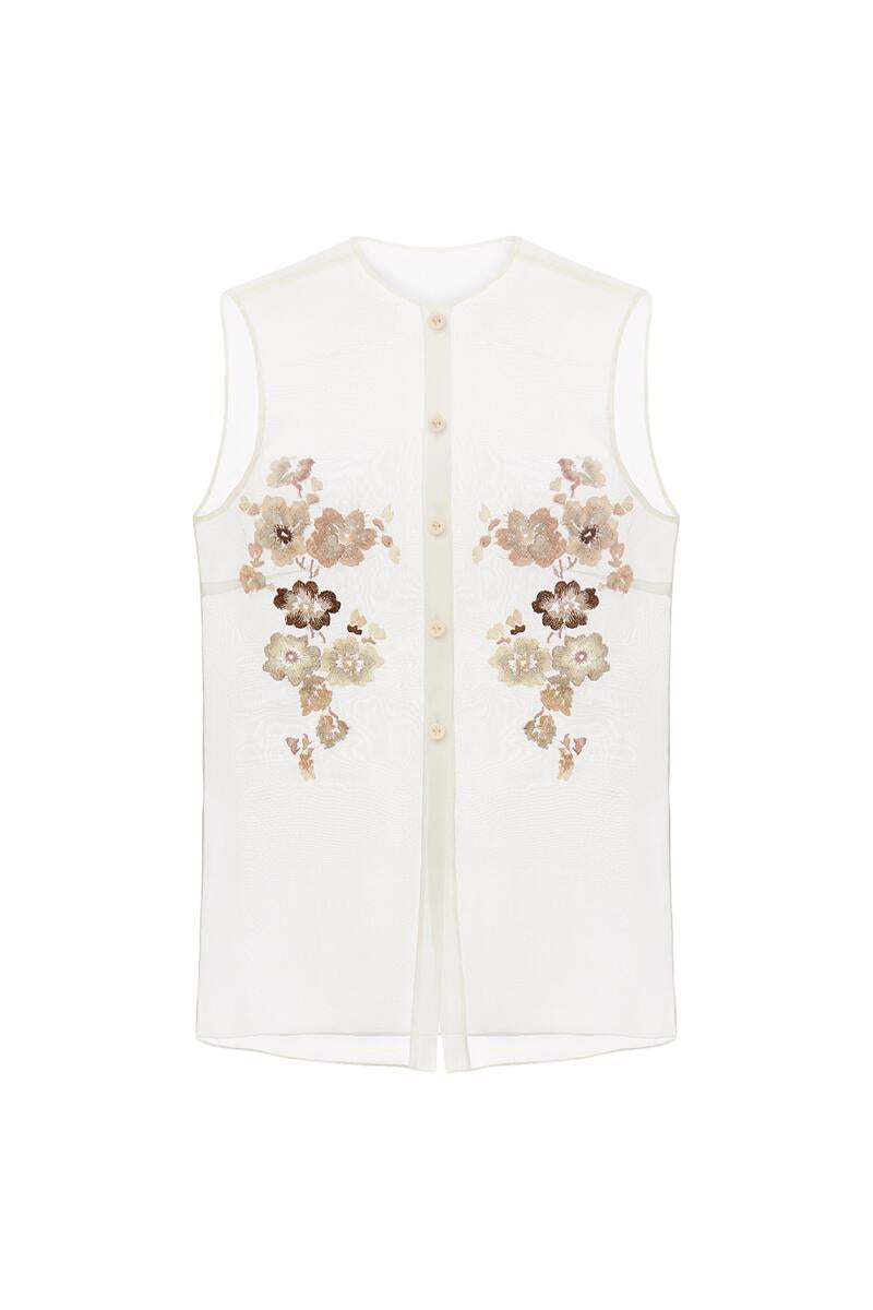 Silk Blossom embroidered shirt by Delegan displayed on a ghost mannequin, showcasing intricate floral embroidery and elegant design.