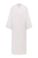 White embroidered kimono gown by DELEGAN displayed on a ghost mannequin, showcasing intricate embroidery and flowing fabric.
